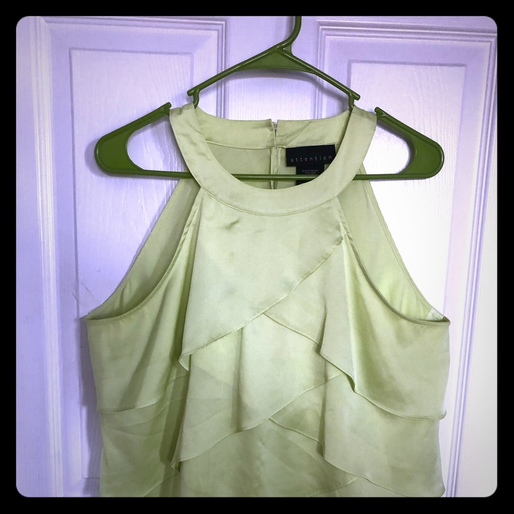 Green button in the back tank top.